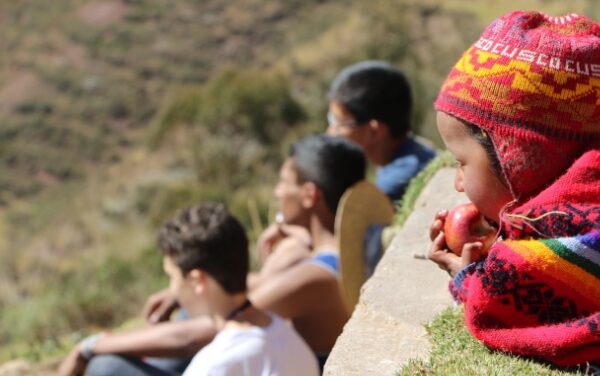 local-child-eating-apple-peru