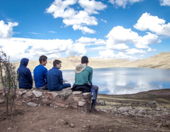 students-sitting-lake-peru-cspera_zackzappone-494