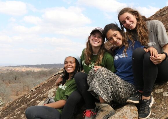 students-smiling-rock-ledge-tanzania-cstana_student_juliannabray-49