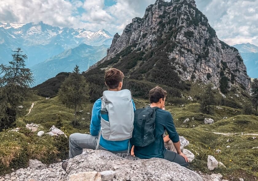 students-sitting-swiss-alps