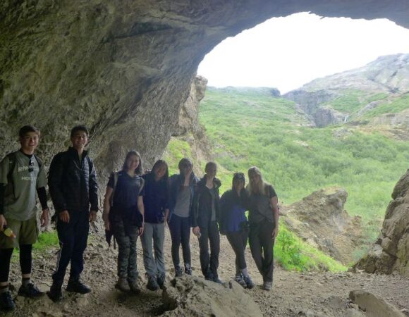 students posing in icelandic cave