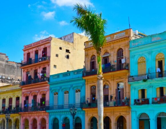 bright blue, pink, and yellow buildings in cuba