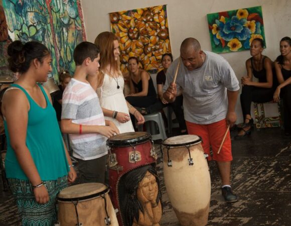 students learning to drum in cuba