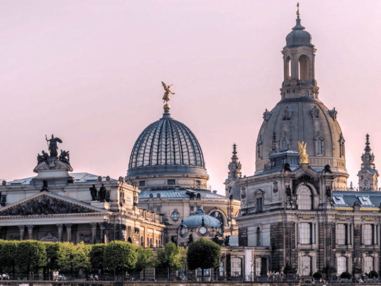 pink sky behind buildings in dresden