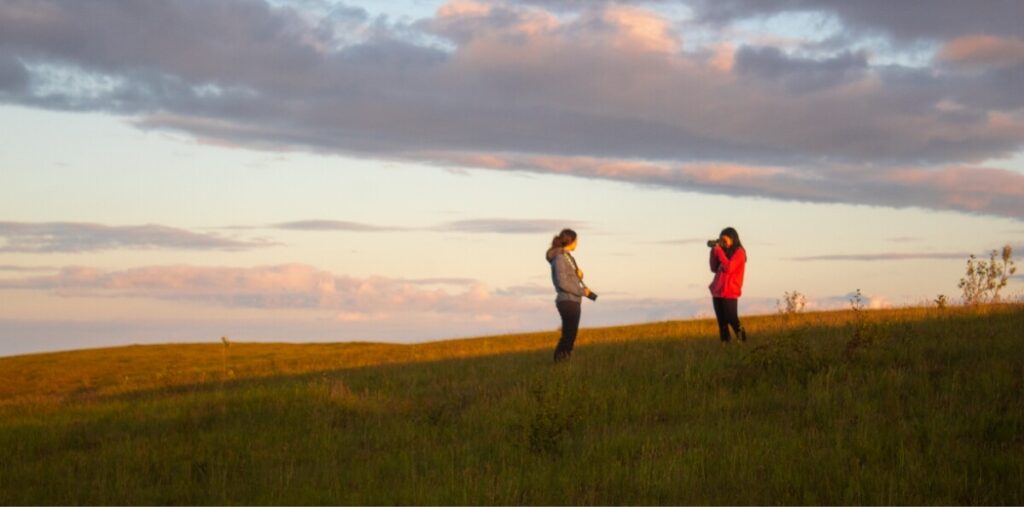 student-photo-shoot-field-sunset-iceland